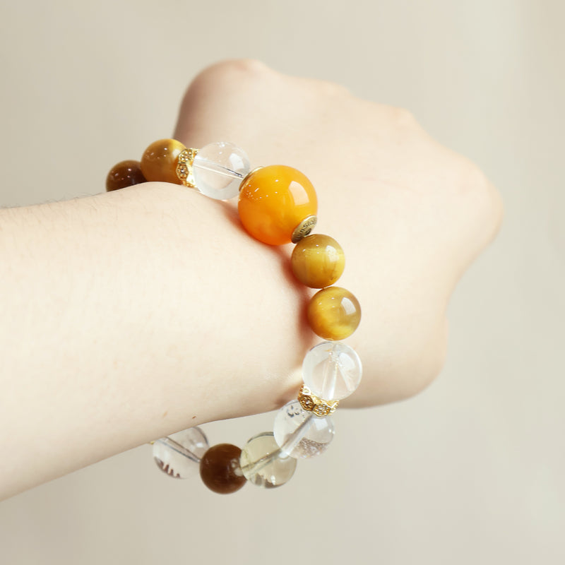 Amber Rise crystal bracelet worn on wrist showing golden gemstone design and everyday AI companion jewelry style