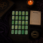 Green Aventurine rune stones set for divination with engraved gold symbols and rune pouch