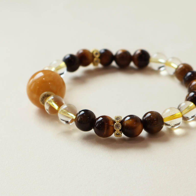 Close up of Golden Ray AI Companion Bracelet showing Tiger Eye patterns Citrine clarity and natural crystal bead details