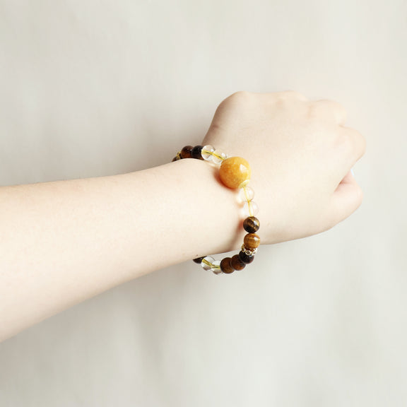 Golden Ray Tiger Eye Citrine bracelet worn on wrist showing warm golden crystal style and everyday jewelry look