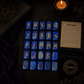 Lapis Lazuli rune stones set for divination with engraved gold symbols and rune pouch