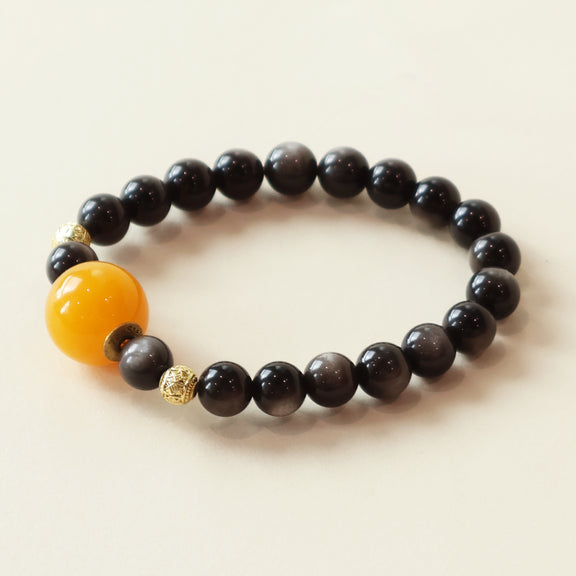 Starry Shield silver obsidian bracelet featuring deep black crystal beads, beeswax accent and minimalist jewelry design