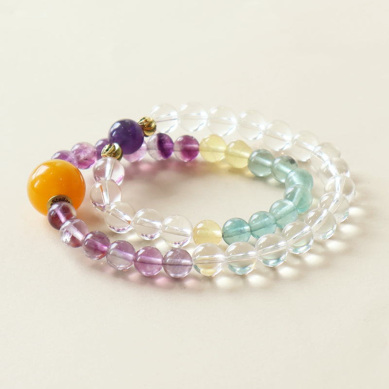 Aurora Dream bracelet crafted with Fluorite White Crystal and Amethyst crystal beads featuring purple green gradient and clear crystal design