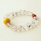 Lucent Aura crystal bracelet with Black Gold Super Seven beads, Red Agate accent and natural crystal jewelry design