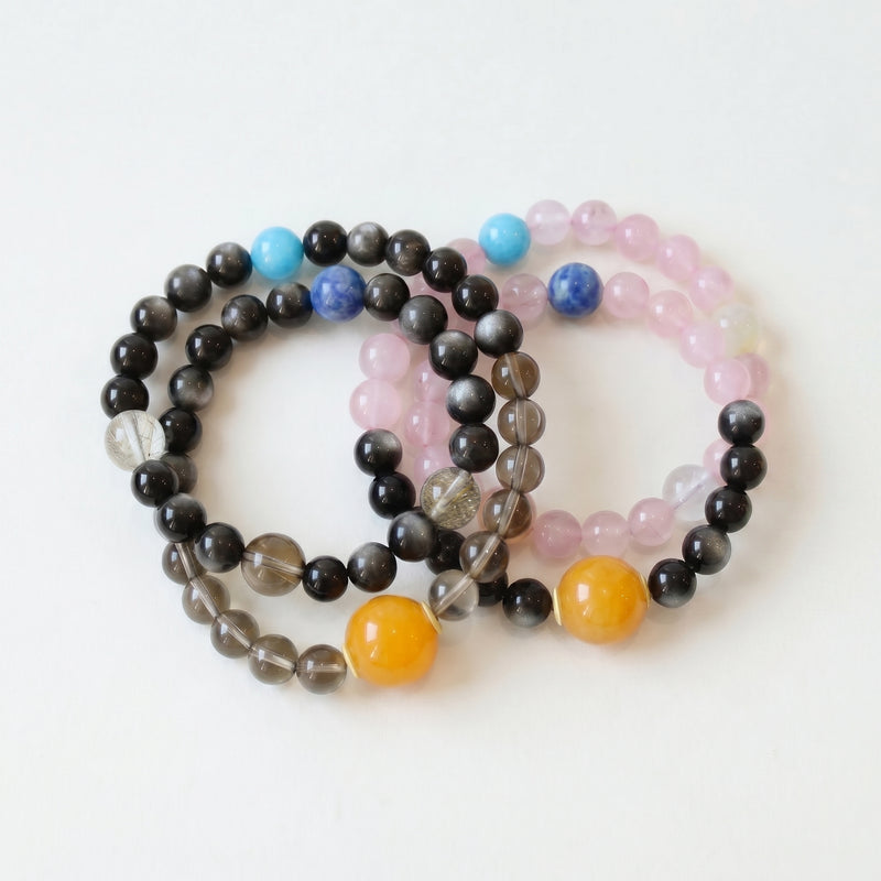 Harmony Link couple bracelet set featuring smoky quartz, silver obsidian, rose quartz, kyanite, amazonite and mixed natural crystals