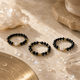 Black spinel and freshwater pearl ring set of three with crystal-inspired styling