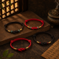 Four Eastern Harmony Ruyi knot bracelets in red and dark brown with jade and classic cord styles