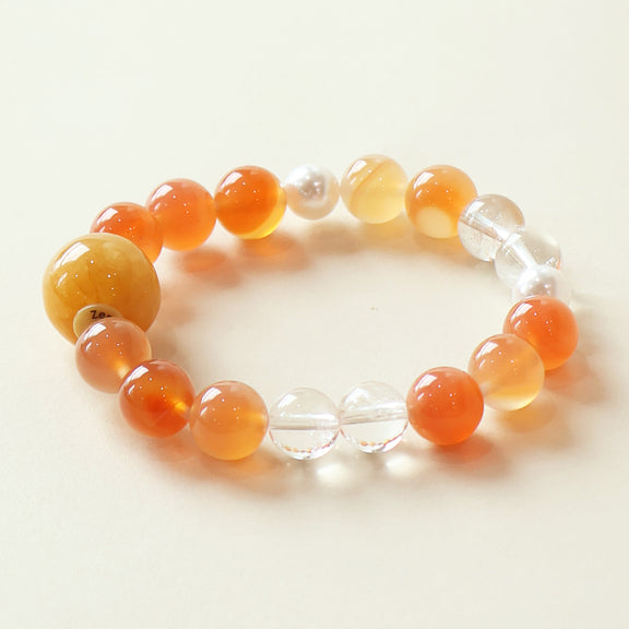 Bloom Aura bracelet crafted with Cherry Blossom Agate and White Azeztulite crystal beads with warm orange and clear crystal design