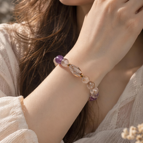 Black Gold Super Seven and Amethyst bracelet worn on wrist