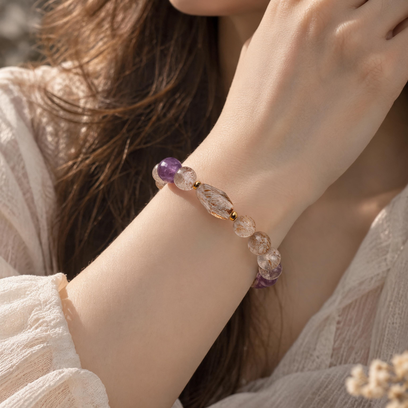 Black Gold Super Seven and Amethyst bracelet worn on wrist