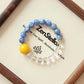 Sky Clarity AI bracelet displayed on elegant tray with blue Kyanite and Clear Quartz crystal beads premium jewelry presentation