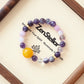 Violet Whisper AI Companion Bracelet displayed on elegant tray featuring purple crystal beads and mindful jewelry design