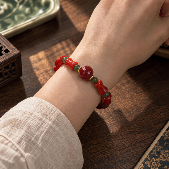 Red agate and Hetian jade bracelet worn on wrist