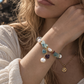 Natural fluorite and freshwater pearl bracelet worn on wrist