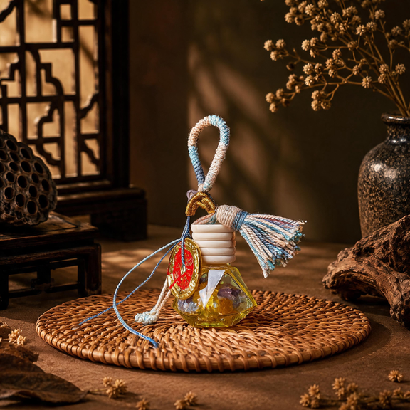 Five Elements crystal wishing bottle charm with pink woven tassel and colorful crystal chips