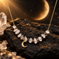 Crescent moon necklace with ice obsidian and clear quartz chips