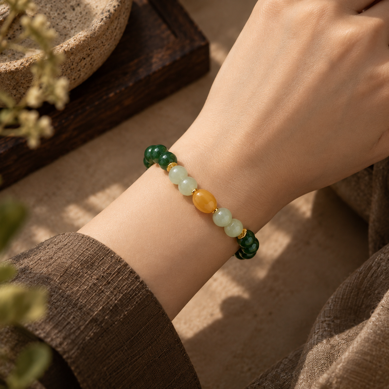Green Nephrite Jade and Amber bracelet worn on wrist