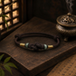 Dark brown Eastern Harmony Ruyi knot bracelet with natural jade beads and gold-tone accents