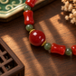 Round red agate centerpiece with Hetian jade and gold-tone accents