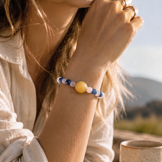 Libra crystal bracelet worn on wrist featuring Rose Quartz and Kyanite gemstones