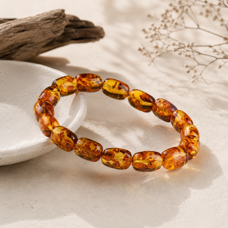 Amber bead bracelet showing polished freeform shapes and natural color variations