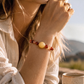 Aries crystal bracelet worn on wrist with Red Agate and Sunstone gemstones