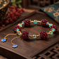 Garnet and amazonite gemstone bracelet with dangling decorative details