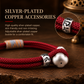 Close-up of silver-plated copper details on Persimmon Wish red cord bracelet
