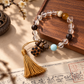 Clear quartz agarwood and larimar tassel bracelet in Eastern-inspired setting