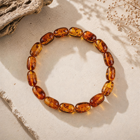 Freeform amber bracelet with polished translucent beads in warm golden tones