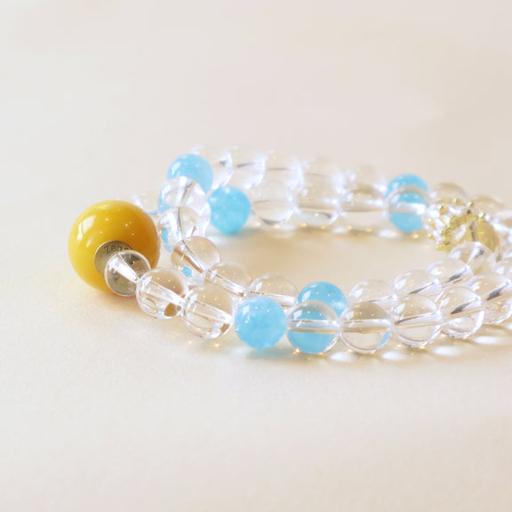 Close up view of Aqua Veil bracelet highlighting transparent crystal texture, blue chalcedony accents and bead craftsmanship
