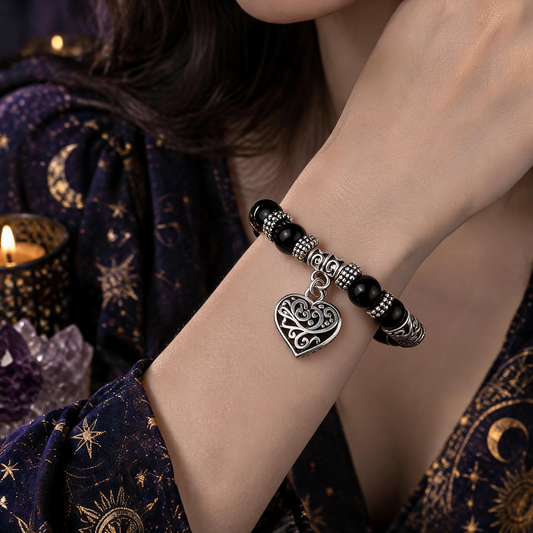 Mixed crystal heart charm bracelet worn on wrist