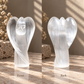 Front and back view of Moroccan selenite guardian angel carving
