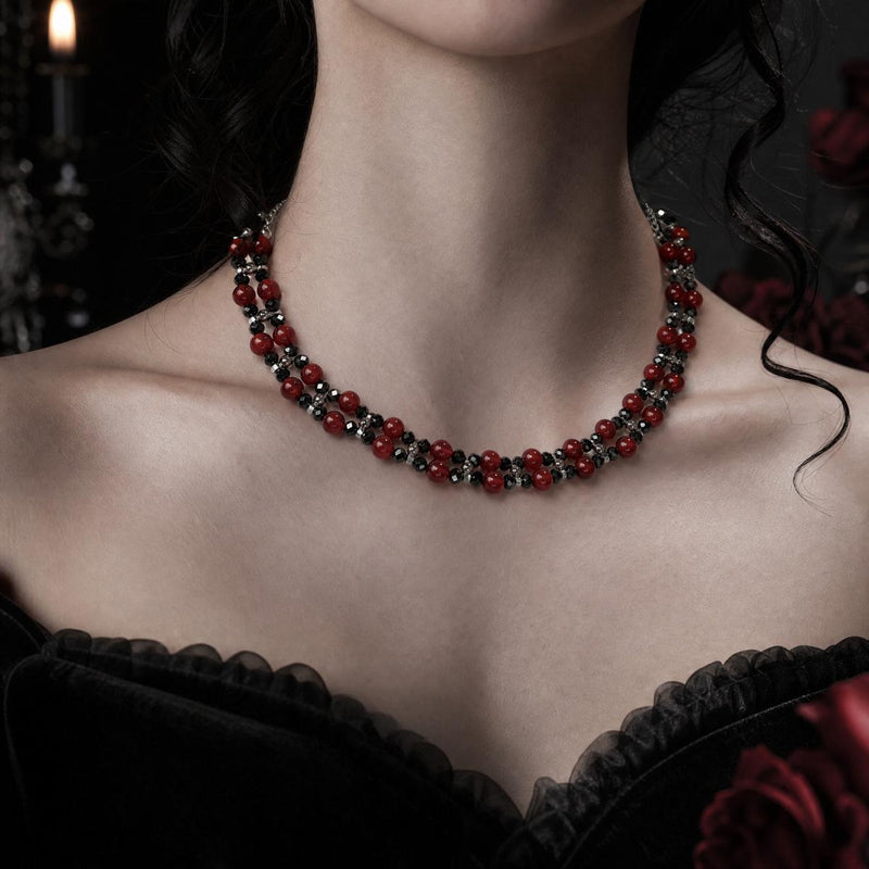 Red agate and black spinel necklace worn with gothic styling