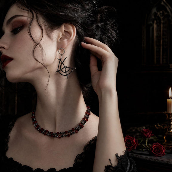 Blood Moon spiderweb necklace and earrings worn together