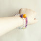 Aurora Dream Fluorite White Crystal Amethyst bracelet worn on wrist showing colorful crystal style and everyday jewelry look