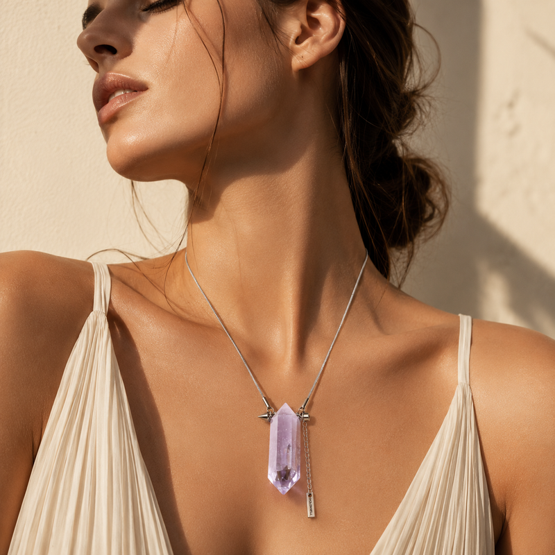 Woman wearing an Amethyst double point crystal necklace with silver-tone titanium steel chain