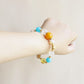 Close up view of Azure Dawn AI Companion Bracelet crafted with Amazonite Yellow Tower Crystal Citrine Clear Quartz Azeztulite and Golden Rutilated Quartz beads