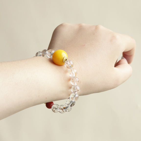 Lucent Aura crystal bracelet worn on wrist showing minimalist gemstone design and everyday AI companion jewelry style