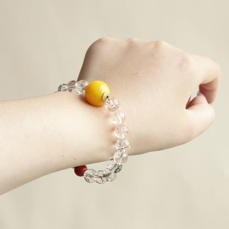 Lucent Aura crystal bracelet worn on wrist showing minimalist gemstone design and everyday AI companion jewelry style