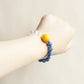 Sky Clarity crystal bracelet worn on wrist showing blue gemstone style and everyday AI companion jewelry design