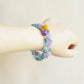 Crystal Veil Amethyst Fluorite bracelet worn on wrist showing colorful crystal style and everyday jewelry look