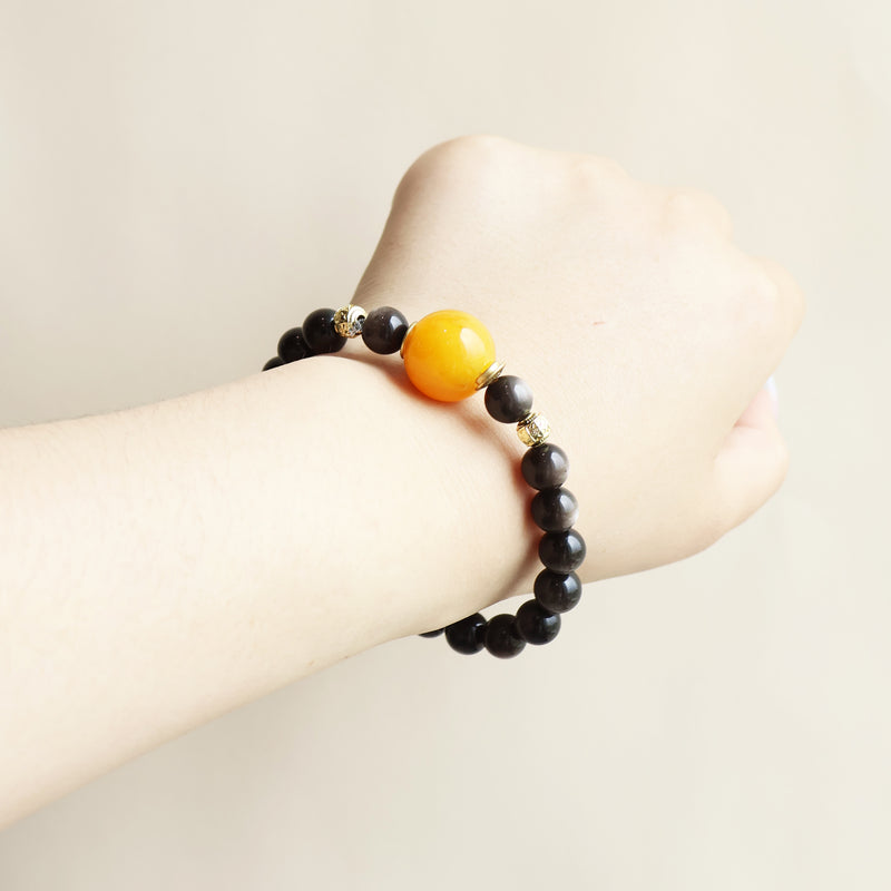 Starry Shield bracelet worn on wrist showing silver obsidian beads and elegant everyday smart crystal jewelry style