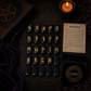 Obsidian rune stones set for divination with engraved gold symbols and rune pouch