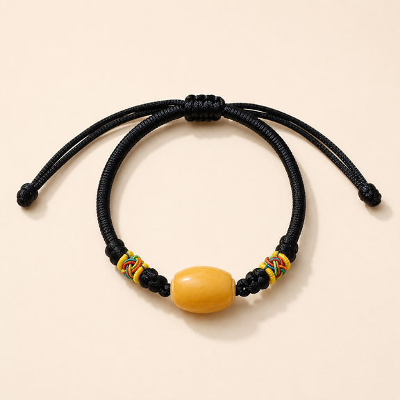 Black adjustable woven cord AI companion bracelet with yellow core bead