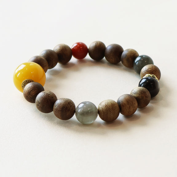 Close-up view of Eastern Wisdom Agarwood Crystal Bracelet showing natural agarwood beads and carefully selected crystal details