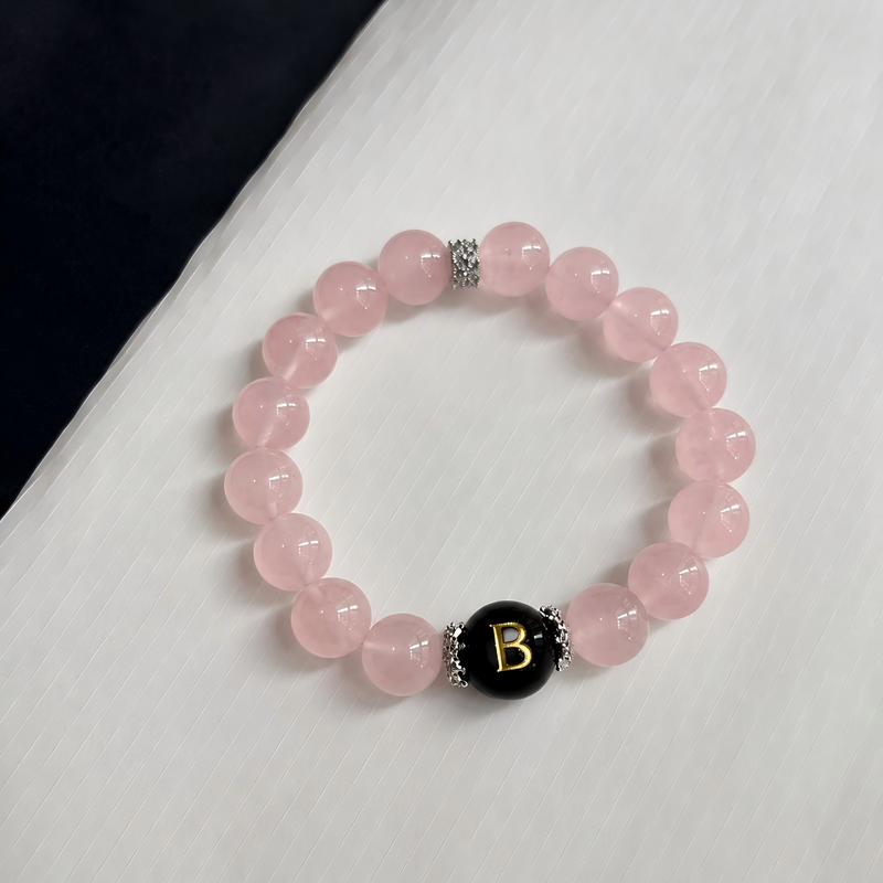 Natural Rose Quartz paired with your chosen initial creates an elegant bracelet that celebrates warmth, connection, and meaningful moments.