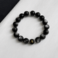 Crafted with natural Silver Obsidian and finished with your selected initial, creating a timeless bracelet designed for everyday wear.