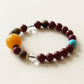 Eastern inspired Agarwood and Cinnabar Bracelet featuring clear quartz beads and turquoise accents