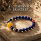 Astral Orbit Zenith Crystal Bracelet crafted with natural Lapis Lazuli and Red Agate beads with signature AI companion bead displayed on warm natural stone background